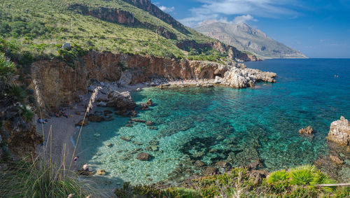 Scenic view of bay against sky