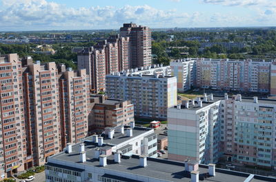 High angle view of buildings in city against sky