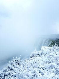 Niagara falls against sky during winter