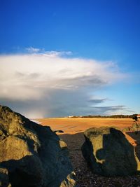 Scenic view of landscape against sky during sunset