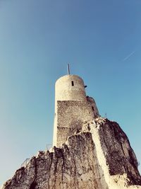 Low angle view of historical building against blue sky