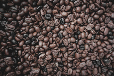 Roasted coffee beans, brown background