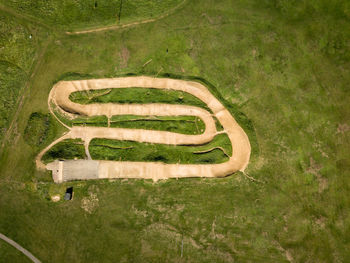 Aerial view of green landscape during sunny day