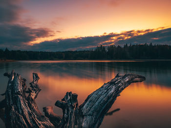 Scenic view of lake against sky during sunset