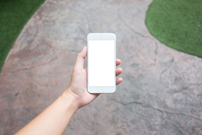 Midsection of person holding smart phone