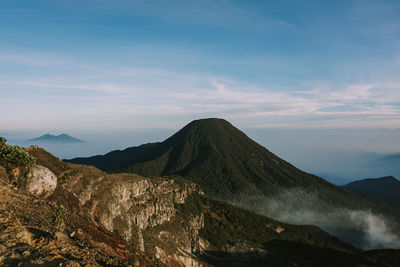 Scenic view of volcanic mountain against sky