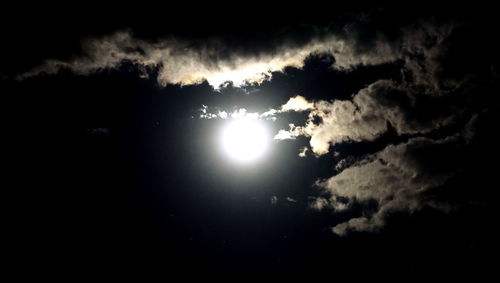 Low angle view of moon in sky at night