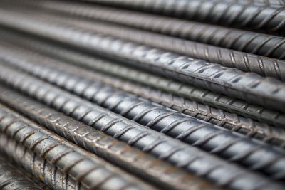 Stack of steel bar texture in construction site for background. selective focus.