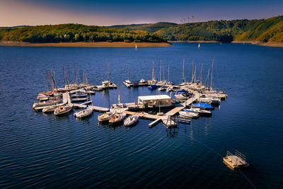 Boat dock in the shape of a heart with many sailboats on the ruhrsee in the national park eifel 