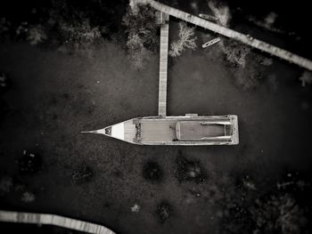 Old boat against trees and plants