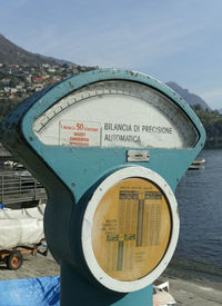 Information sign against sky