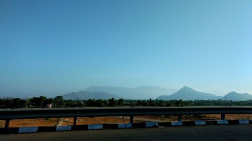 Scenic view of mountains against clear blue sky