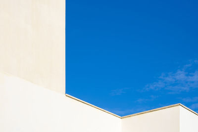 Low angle view of building against blue sky