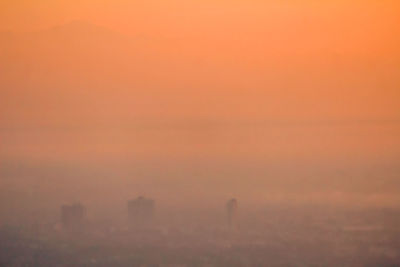 Scenic view of sunset over city