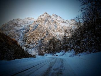 Scenic view of snowcapped mountains against sky