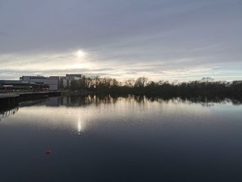 Scenic view of lake against sky during sunset