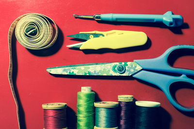 Close-up of multi colored sewing threads on table