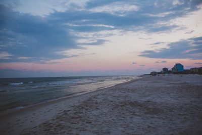 Scenic view of beach against sky during sunset