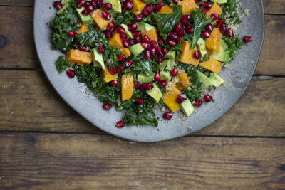 High angle view of fruits in plate on table