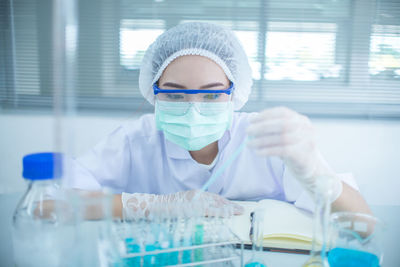 Scientist working at table in laboratory