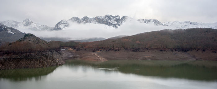 Scenic view of mountains and lake against sky