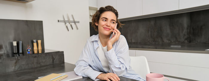 Young businesswoman working at table