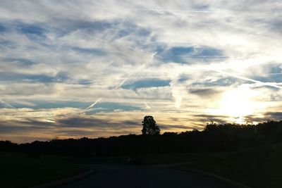 Scenic view of landscape against cloudy sky