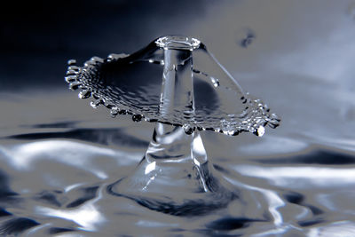 Close-up of water splashing on glass