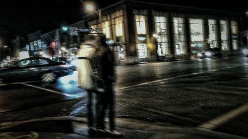 Illuminated city street at night