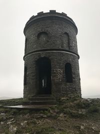 Low angle view of old ruin against sky