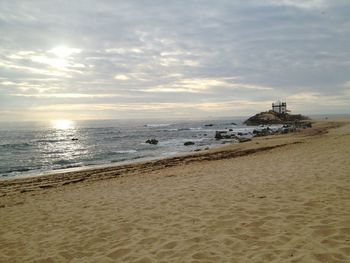 Scenic view of sea against cloudy sky