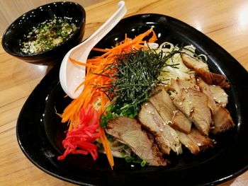 High angle view of meat in bowl on table