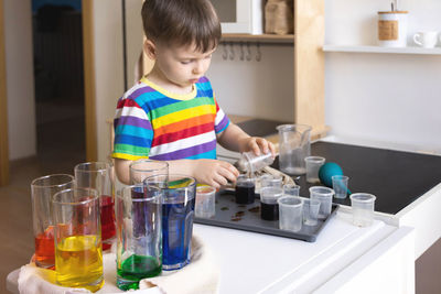 Portrait of boy playing in laboratory