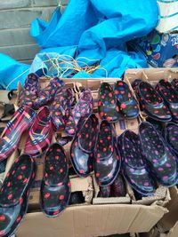 High angle view of shoes for sale at market stall