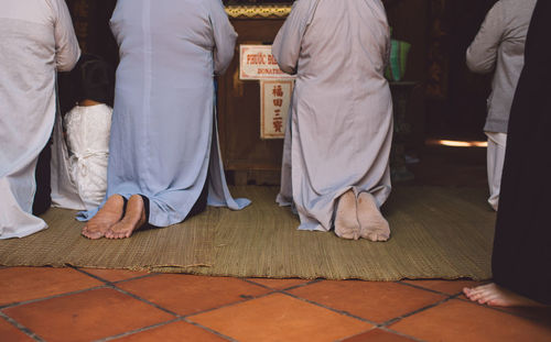 Low section of women praying in shrine