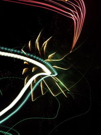 Close-up of light painting against black background