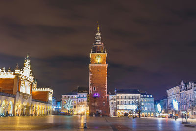 Illuminated buildings in city at night