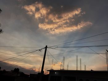 Low angle view of silhouette birds against sunset sky