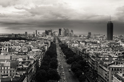 High angle view of street amidst buildings against sky