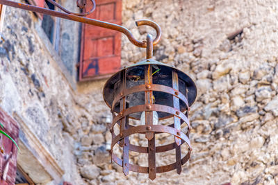 Close-up of metallic structure against wall