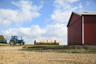 Tractor on field against sky