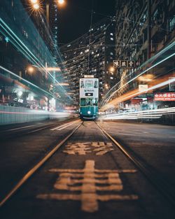 Light trails on railroad tracks at night