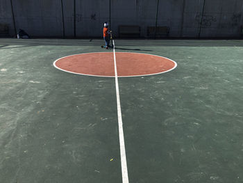 Rear view of man playing with ball