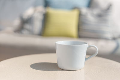 Close-up of coffee cup on table