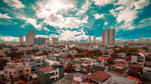 High angle view of buildings in city against sky