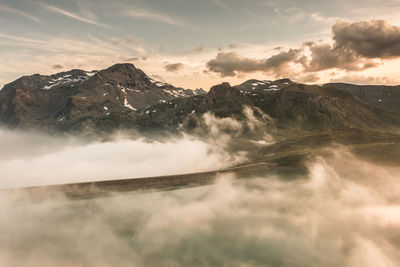 Scenic view of snowcapped mountains against sky during sunset