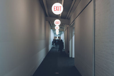 Man walking in corridor of building