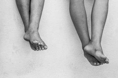 Low section of woman relaxing on floor