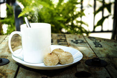 Close-up of coffee cup on table