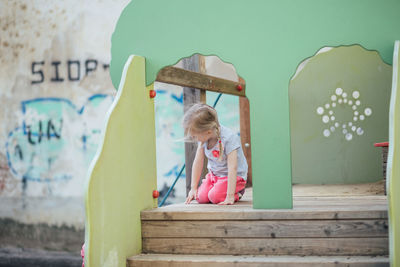 Rear view of woman looking at playground